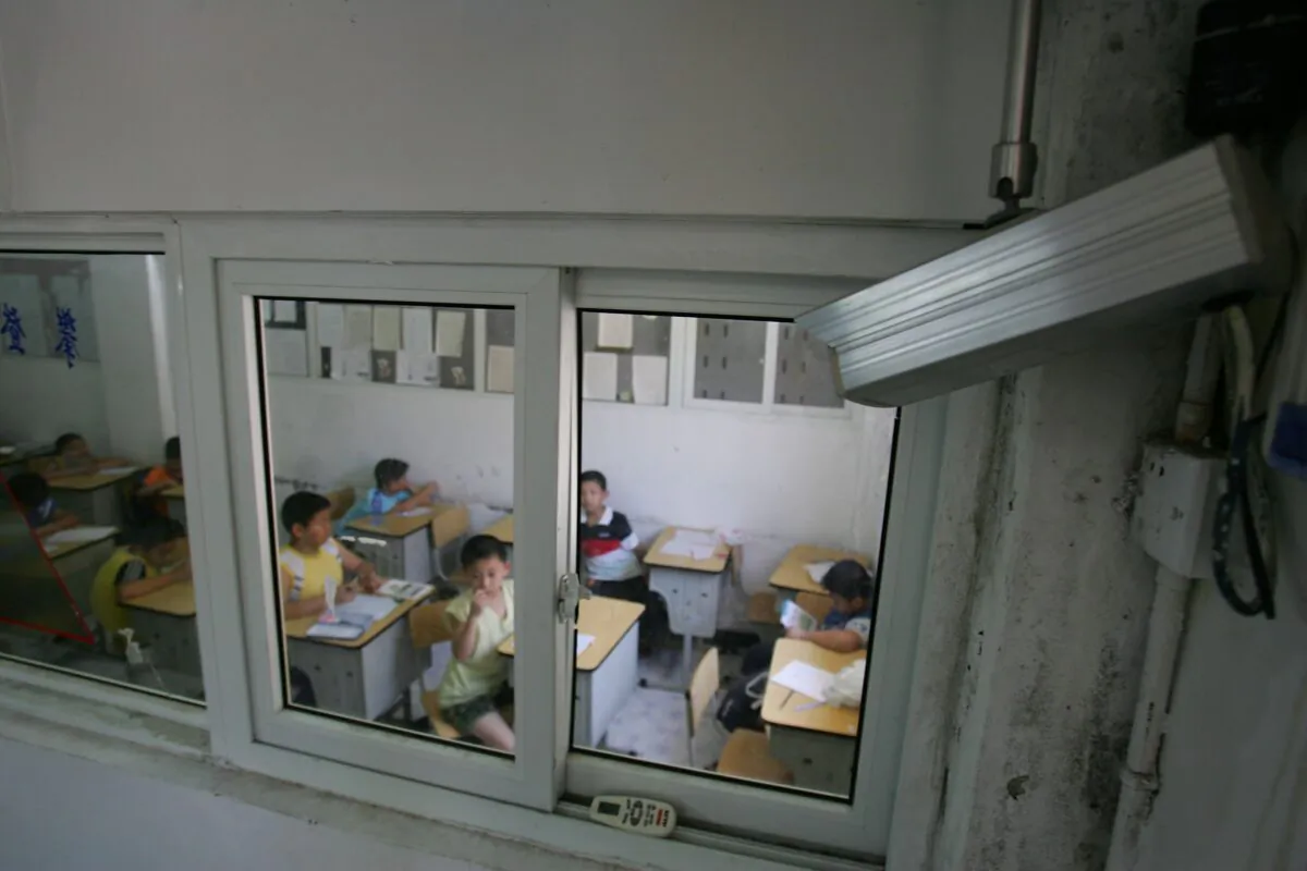 A camera records the activities in a classroom at a university in Hangzhou, Zhejiang Province of China, on Aug. 1, 2006. (Cancan Chu/Getty Images)