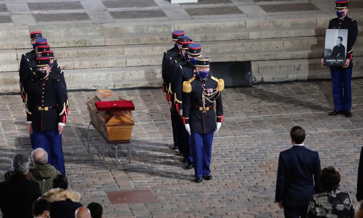 The coffin of slain teacher Samuel Paty is laid in the courtyard of the Sorbonne university during a national memorial event, in Paris, France, on Oct. 21, 2020. (Francois Mori/Pool via Reuters)