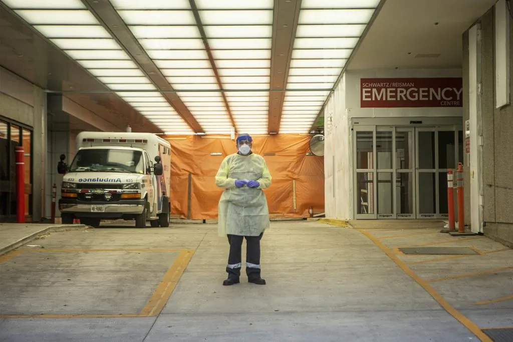 A paramedic stands in the ambulance bay of Mount Sinai Hospital in Toronto on June 6, 2020. (The Canadian Press/Chris Young)
