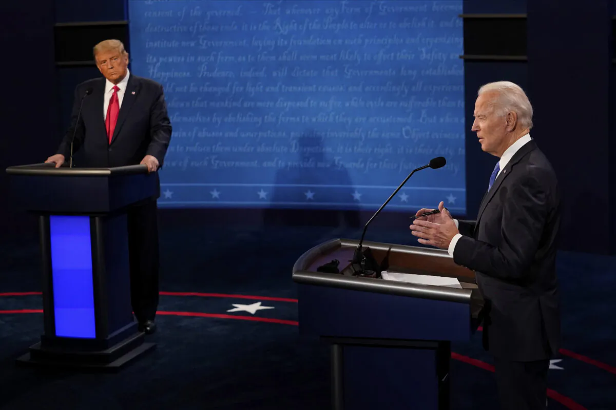 Democratic presidential candidate former Vice President Joe Biden answers a question as President Donald Trump listens during the second and final presidential debate at Belmont University in  Nashville, Tenn. on Oct. 22, 2020. (Morry Gash/AP Photo)