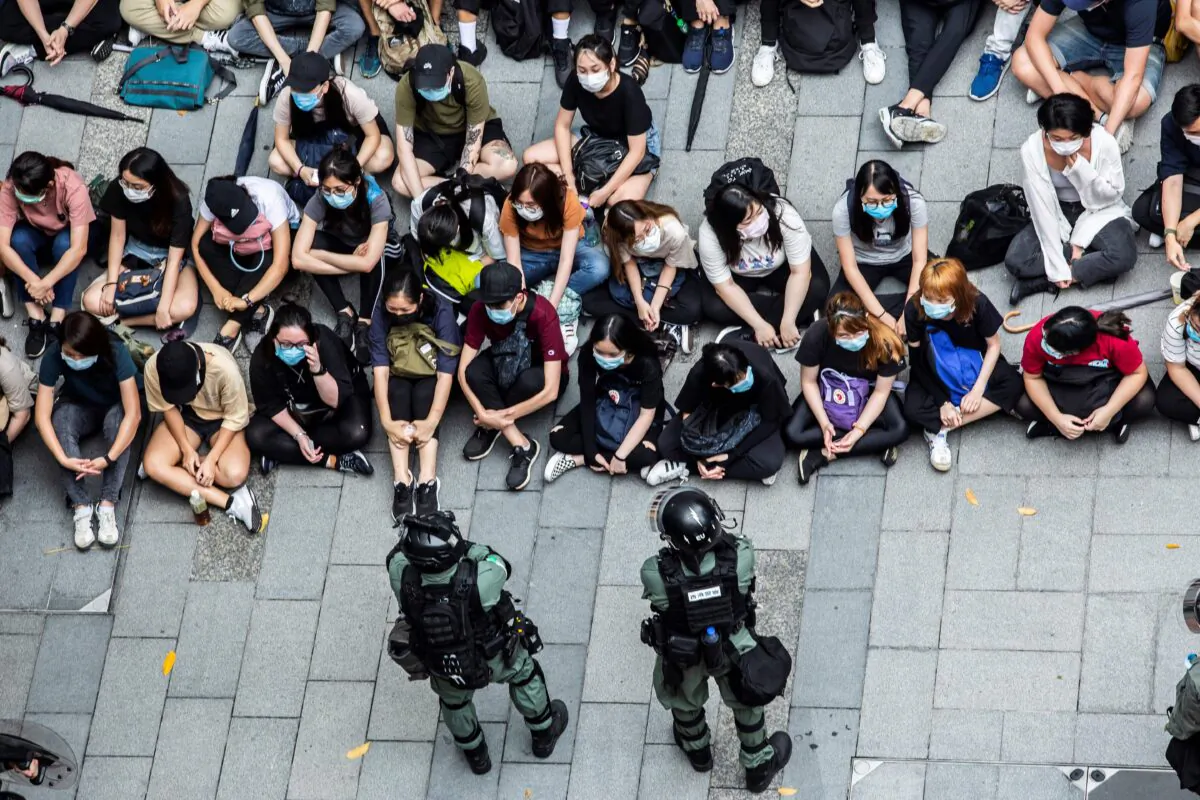 Police detain a group of people during a protest in the Causeway Bay district of Hong Kong on May 27, 2020(Isaac Lawrence/AFP via Getty Images)