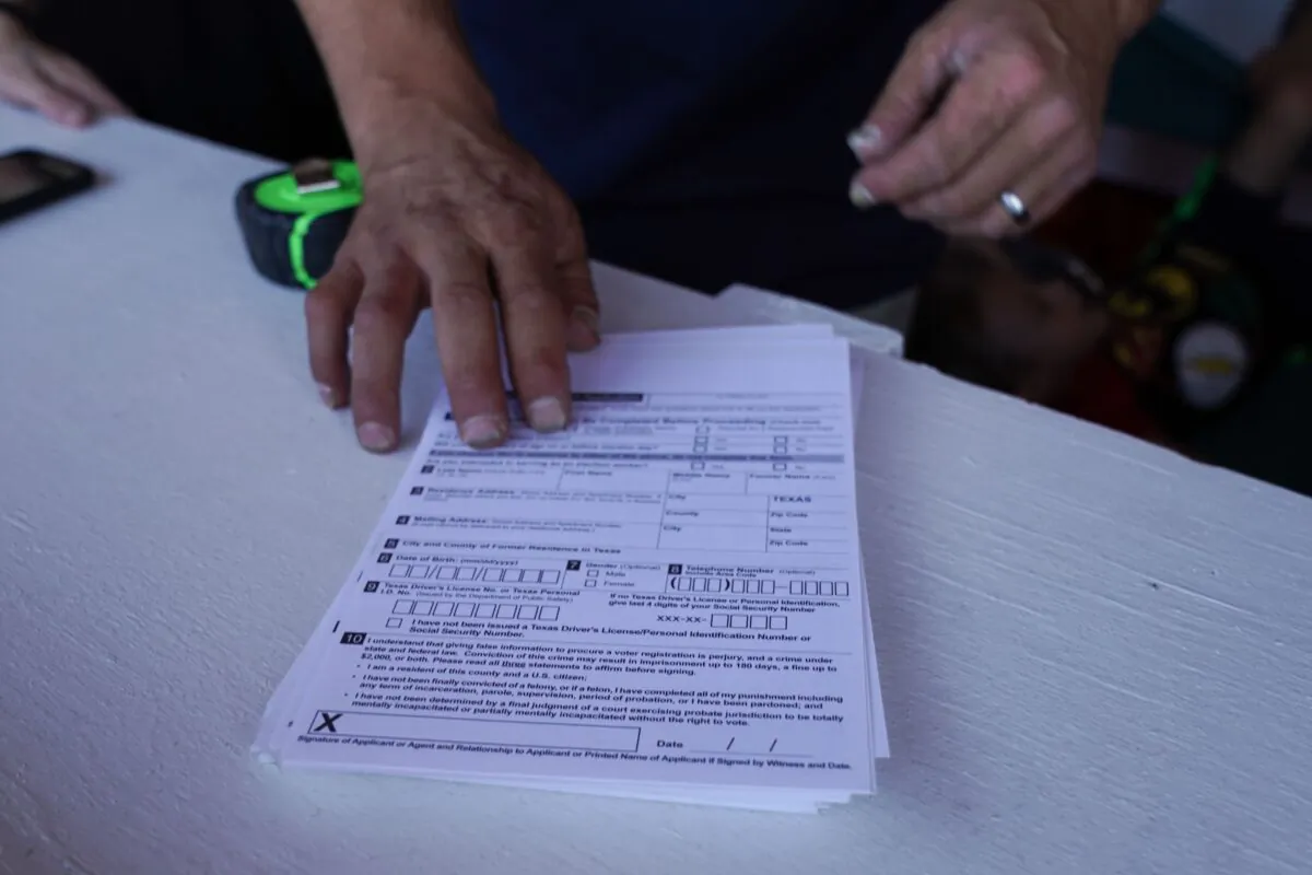 A stack of voter registration forms is shown on July 31, 2020. (Bryan R. Smith/AFP via Getty Images)