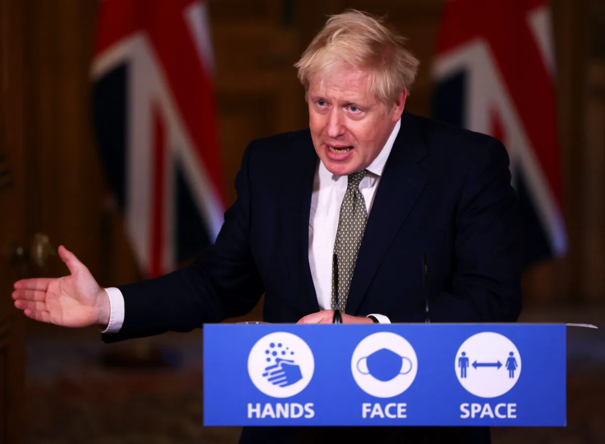 British Prime Minister Boris Johnson addresses the nation during a news conference on the CCP virus at 10 Downing Street, London, on Oct. 22, 2020. (Henry Nicholls- Pool/Getty Images)