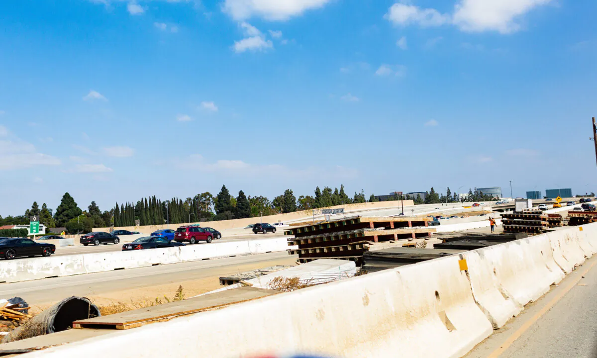 Construction materials line the I-405 freeway in Costa Mesa, Calif., on Oct. 22, 2020. (John Fredricks/The Epoch Times)