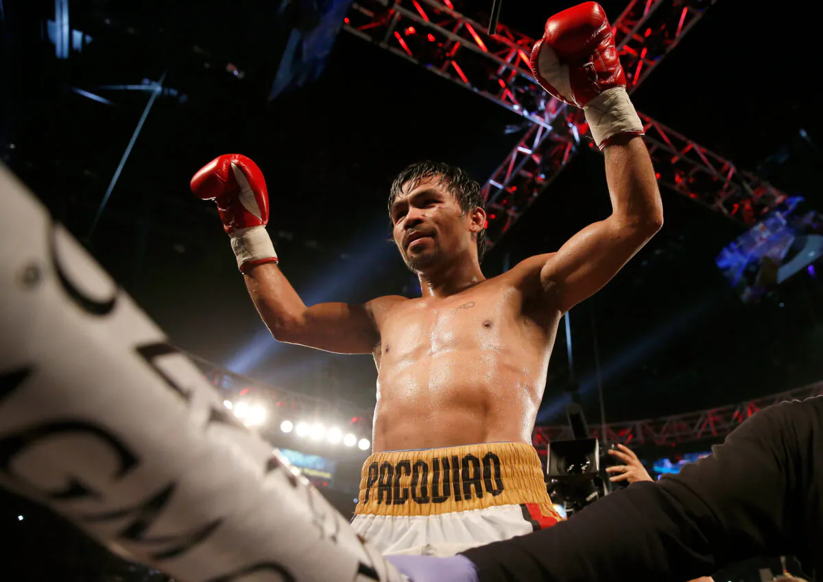 Manny Pacquiao celebrates after defeating Timothy Bradley Jr. by unanimous decision in their welterweight title fight at MGM Grand Garden Arena in Las Vegas on April 9, 2016.  (Christian Petersen/Getty Images)