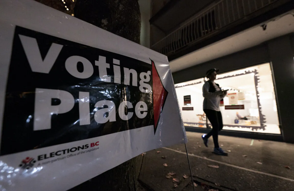 A voter is seen as she takes part at an advanced polling station in North Vancouver, B.C., on Oct. 20, 2020. (The Canadian Press/Jonathan Hayward)