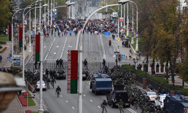 Belarusian law enforcement officers and service members block a street