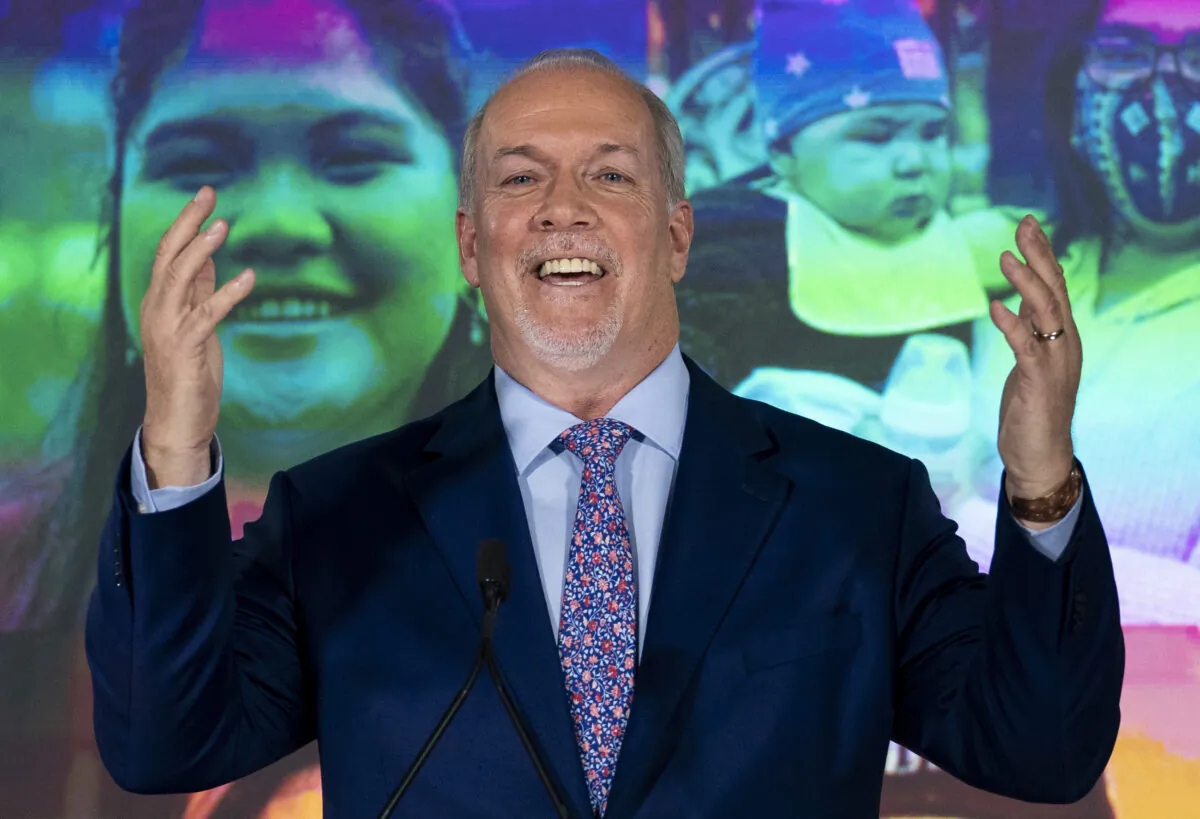 NDP Leader John Horgan celebrates his election win in the BC provincial election in downtown Vancouver on Oct. 24, 2020. (The Canadian Press/Jonathan Hayward)