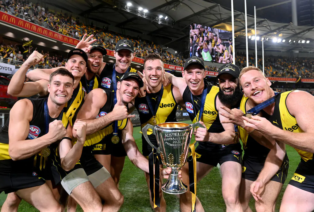 The Tigers players celebrate victory after the 2020 AFL Grand Final match between the Richmond Tigers and the Geelong Cats at The Gabbain, in Brisbane, Australia, on Oct. 24, 2020. (Bradley Kanaris/AFL Photos/via Getty Images)
