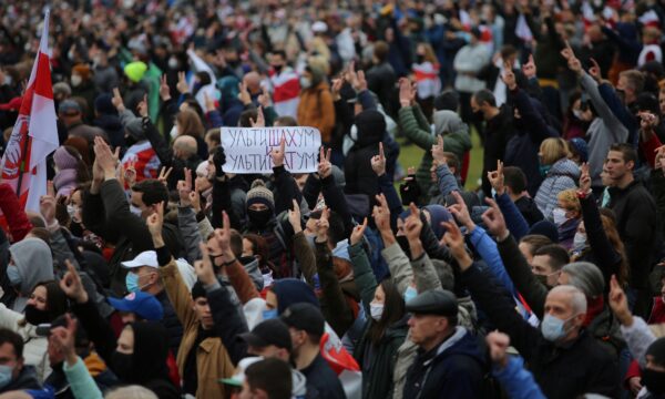 People attend an opposition rally