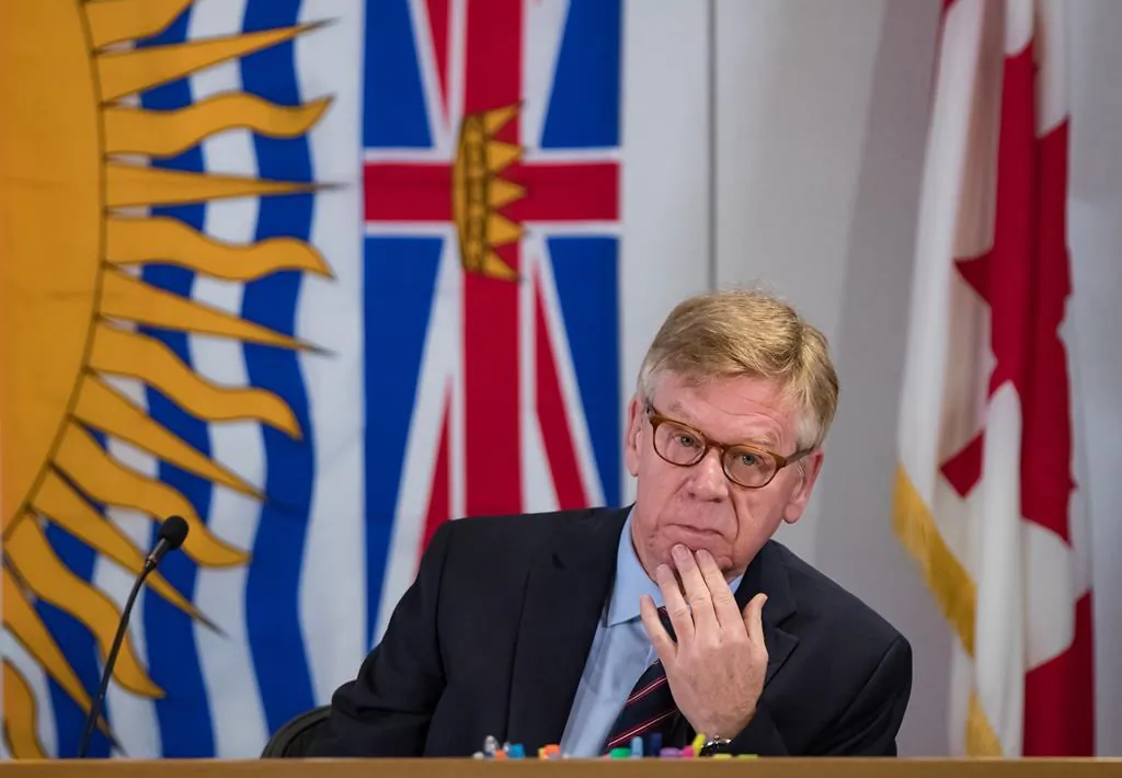 Commissioner Austin Cullen listens to introductions before opening statements at the Commission of Inquiry into Money Laundering in British Columbia, in Vancouver on Feb. 24, 2020. (The Canadian Press/Darryl Dyck)