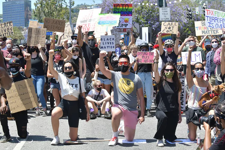Marchers kneel in solidarity for eight minutes and 46 seconds in honor of George Floyd during the All Black Lives Matter Solidarity March in Los Angeles on June 14, 2020. (Rodin Eckenroth/Getty Images)