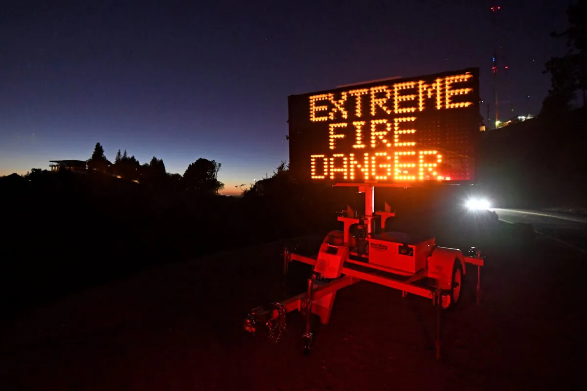 A roadside sign warns motorists of extreme fire danger on Grizzly Peak Boulevard, in Oakland, Calif., on Oct. 25, 2020. (Jose Carlos Fajardo/Bay Area News Group via AP)