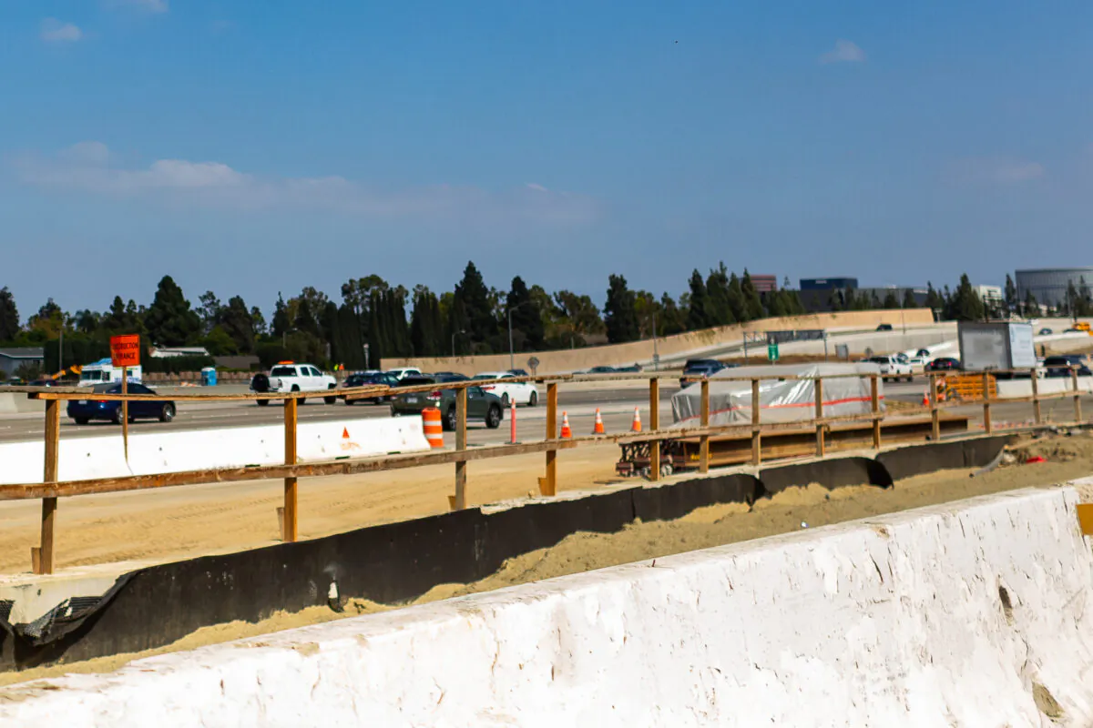 Construction takes place on Interstate 405 in Costa Mesa, Calif., on Oct. 22, 2020. On the local level, the city is preparing to start citywide road repairs in November 2020. (John Fredricks/The Epoch Times)