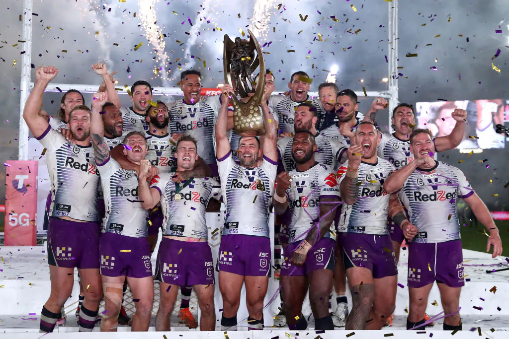 Cameron Smith of the Storm holds aloft the Premiership trophy and celebrates with teammates after winning the 2020 NRL Grand Final match between the Penrith Panthers and the Melbourne Storm at ANZ Stadium on October 25, 2020 in Sydney, Australia. (Cameron Spencer/Getty Images)