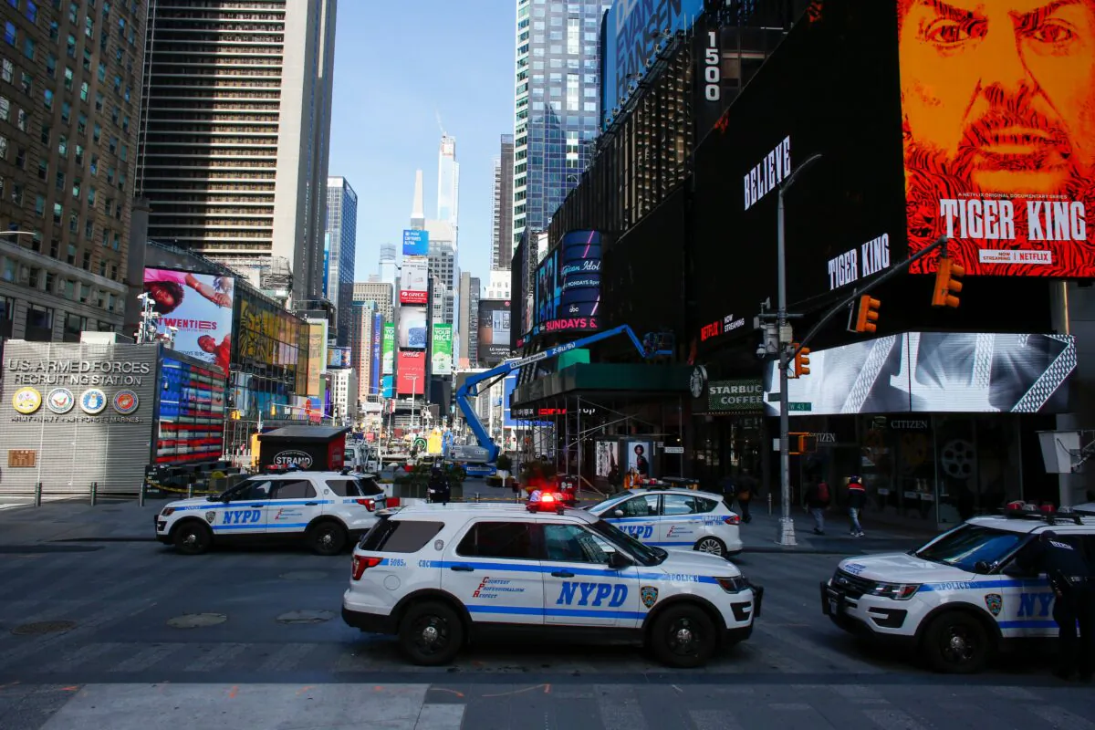 NYPD cars are seen in Times Square in New York City, on March 22, 2020. (Kena Betancur /AFP via Getty Images)