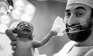 Newborn Snatches Doctor's Mask, Photo Sends Message of Hope Amid COVID-19