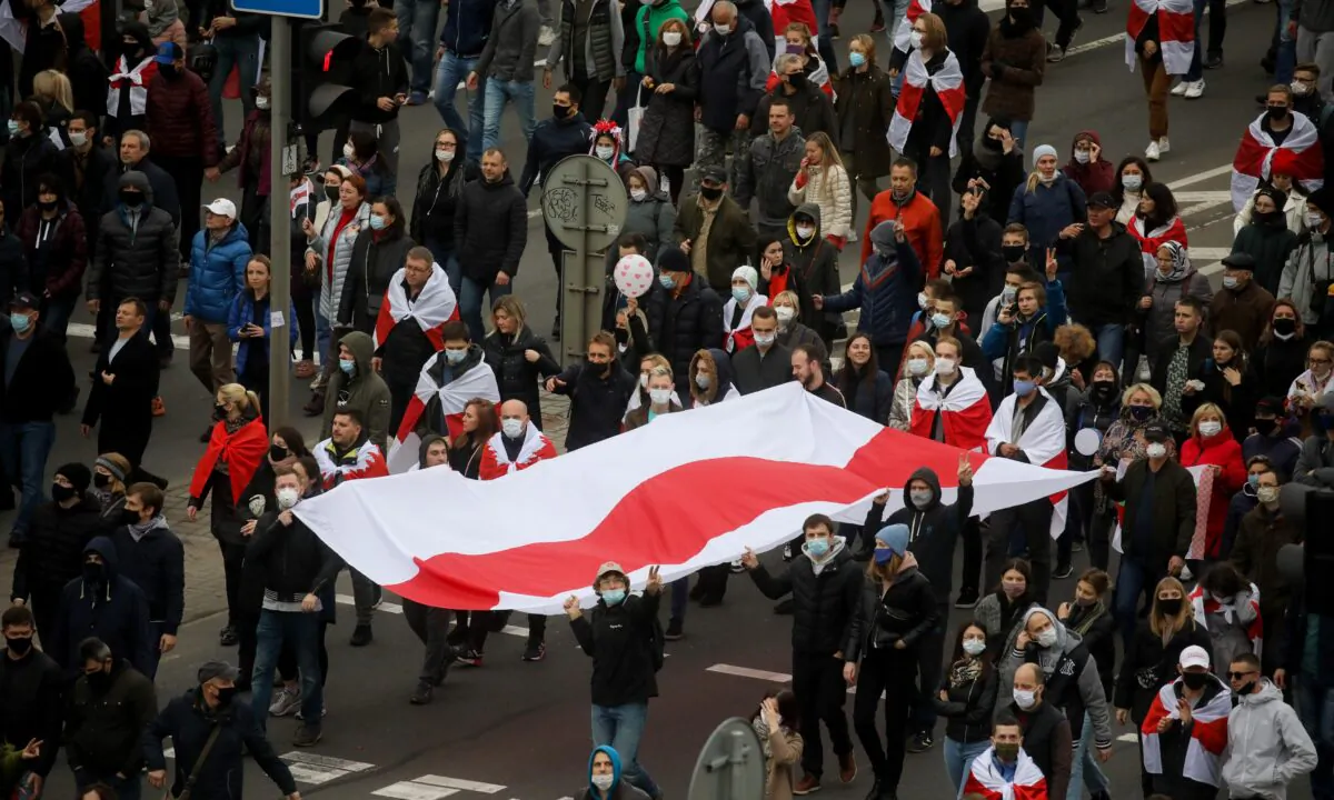 People attend an opposition rally to reject the Belarusian presidential election results in Minsk, Belarus, on Oct. 25, 2020. (BelaPAN via Reuters)