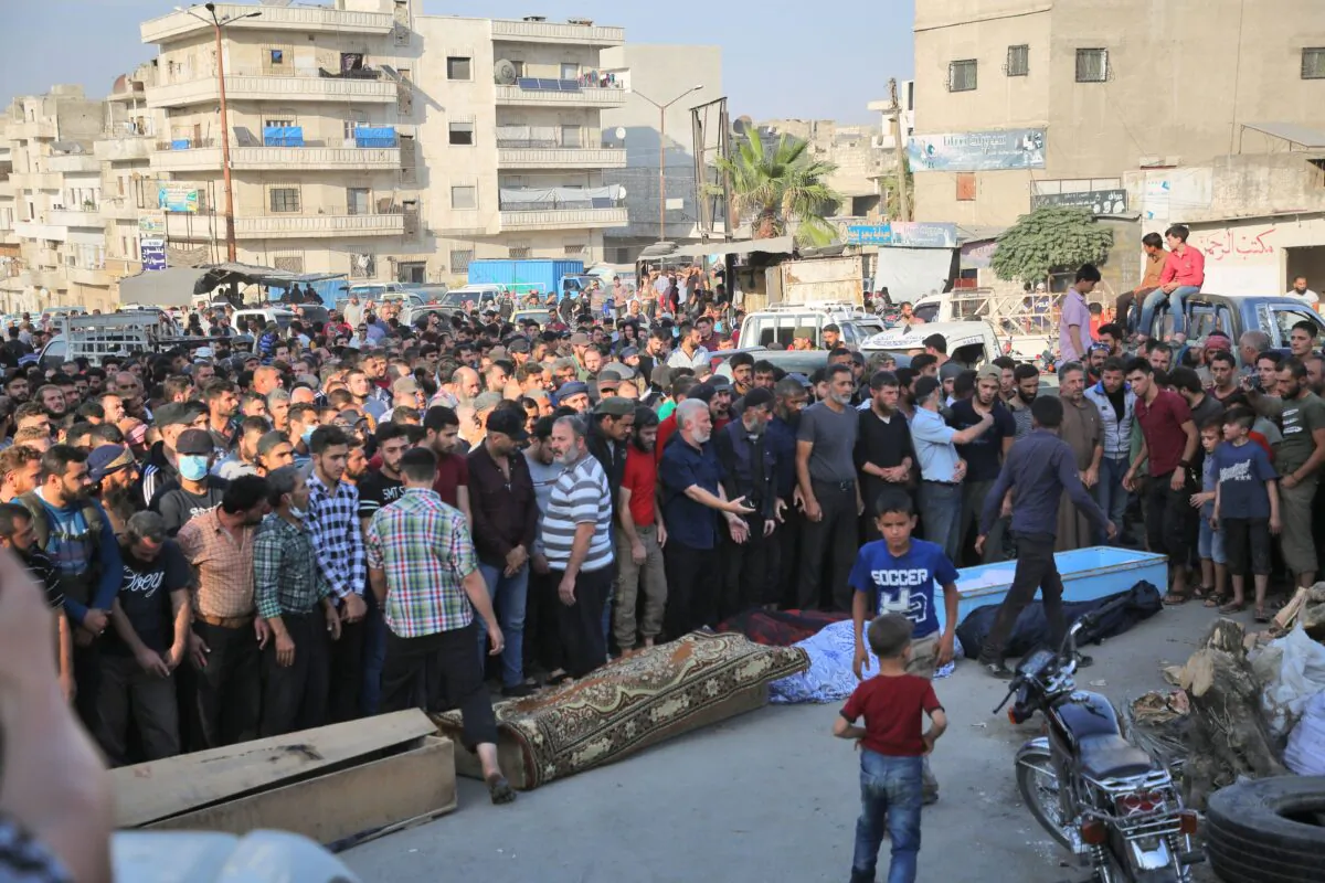 Syrians take part in the funeral of 10 Turkish-backed extremists killed in an airstrike, in the northwestern city of Idlib, Syria, on Oct. 26, 2020. (Mohammed Al-Rifai/AFP via Getty Images)