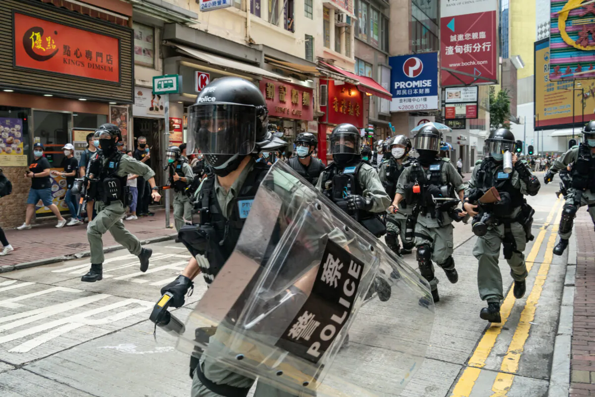 Riot police chase demonstrators in Hong Kong on July 1, 2020. (Getty Images)