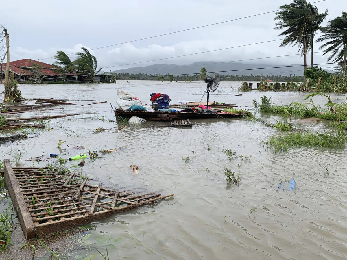 The remains of a house is surrounded by floods in Pola town on the island of Mindoro, central Philippines, on Oct. 26, 2020. (Erik De Castro/ AP Photo)