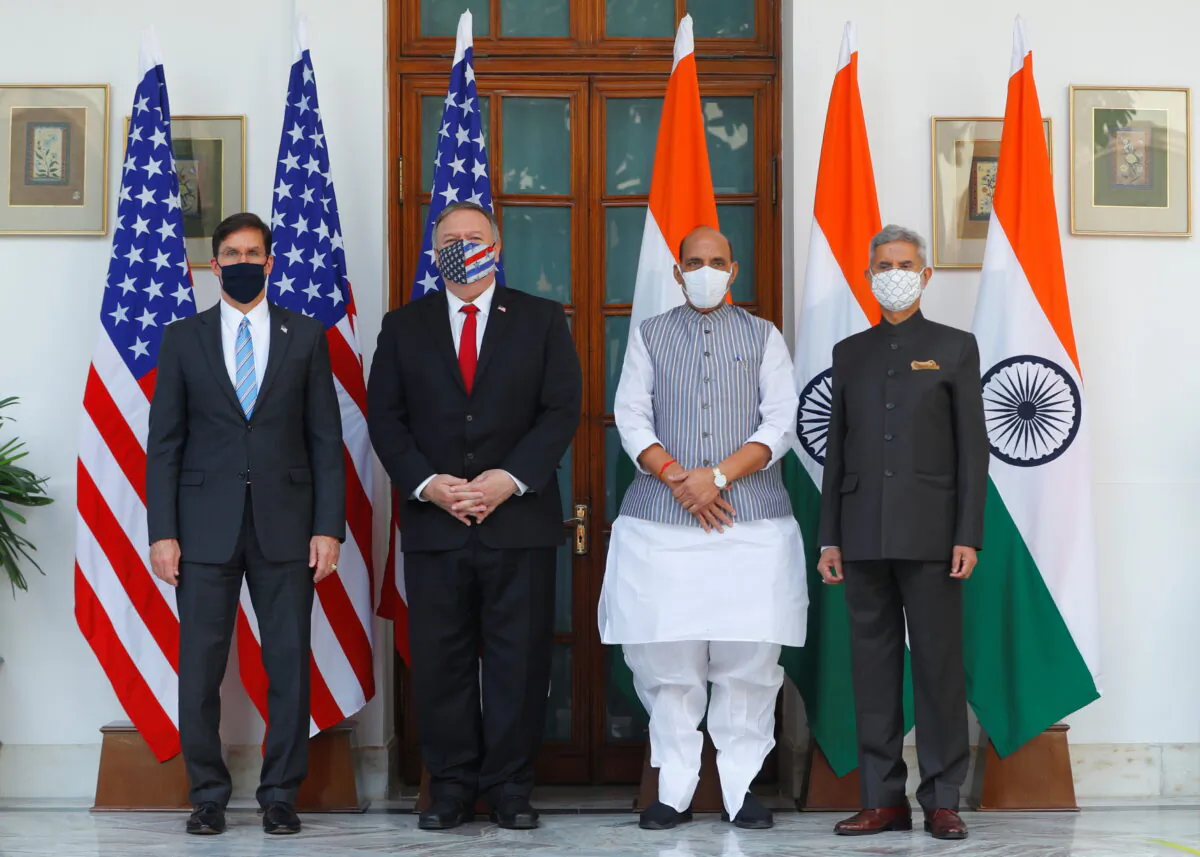 U.S. Secretary of State Mike Pompeo, U.S. Secretary of Defense Mark Esper pose for a picture with India's Foreign Minister Subrahmanyam Jaishankar and India's Defence Minister Rajnath Singh during a photo opportunity ahead of their meeting at Hyderabad House in New Delhi, India, October 27, 2020. (Adnan Abidi/Reuters/Pool)