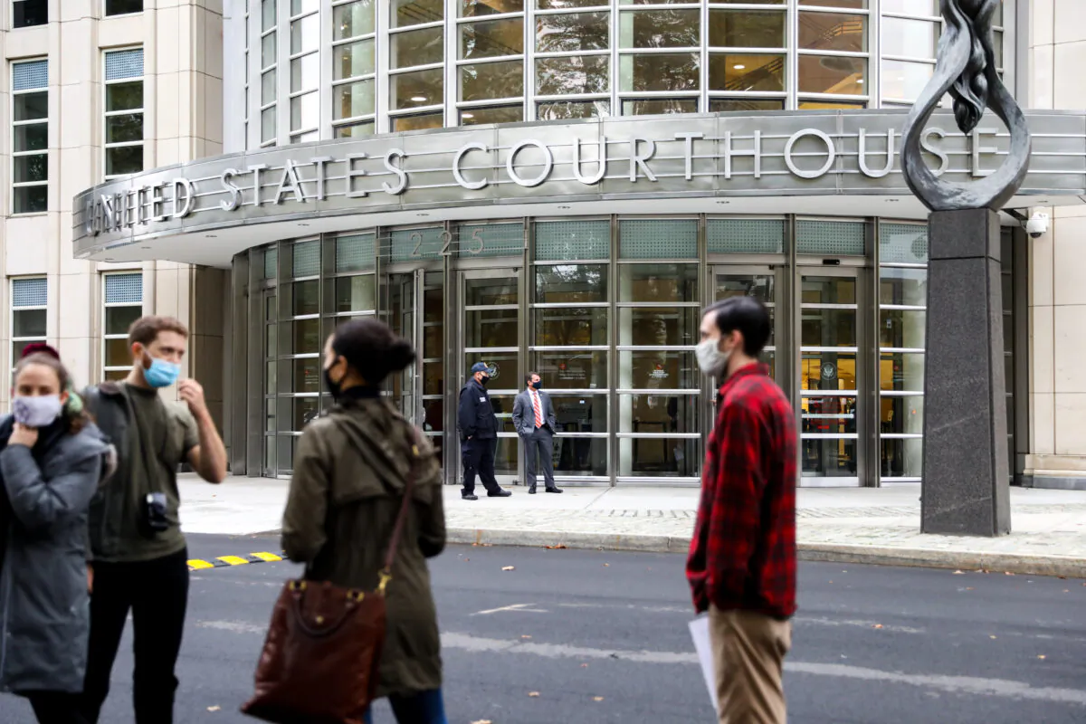Reporters and photographers are waiting outside of U.S. District Court for the Eastern District of New York on Oct. 27, 2020. (Chung I Ho/The Epoch Times)