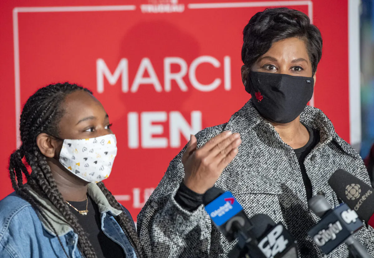 Marci Ien holds a media availability with her daughter Blaize Exeter by her side after winning the Federal byelection in Toronto Centre, on Oct. 26, 2020. (The Canadian Press/Frank Gunn)