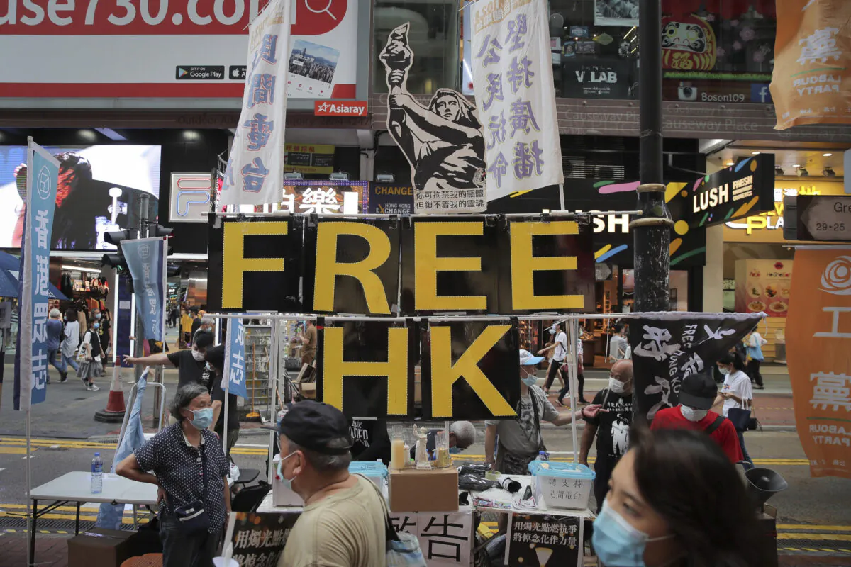 A booth with sign "Free Hong Kong" is set up near Victoria Park where people gather to mourn those killed in the 1989 Tiananmen crackdown in Causeway Bay, Hong Kong on June 4, 2020. (Kin Cheung/The Associated Press)