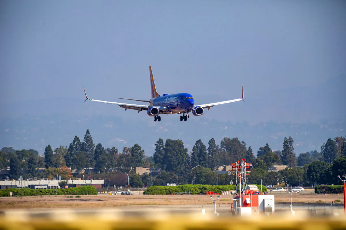 A Southwest Airlines jet lands at John Wayne Airport in Orange County, Calif., on Oct. 18, 2020. (John Fredricks/The Epoch Times)