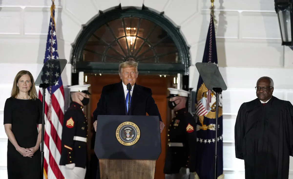 President Donald Trump speaks before Supreme Court Justice Clarence Thomas administers the Constitutional Oath to Amy Coney Barrett on the South Lawn of the White House in Washington, Oct. 26, 2020. (AP Photo/Alex Brandon)