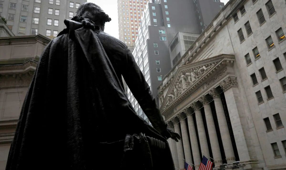 A statue of George Washington stands as Federal Hall across Wall Street from the New York Stock Exchange in New York on Oct. 26, 2020. (Mike Segar/Reuters)