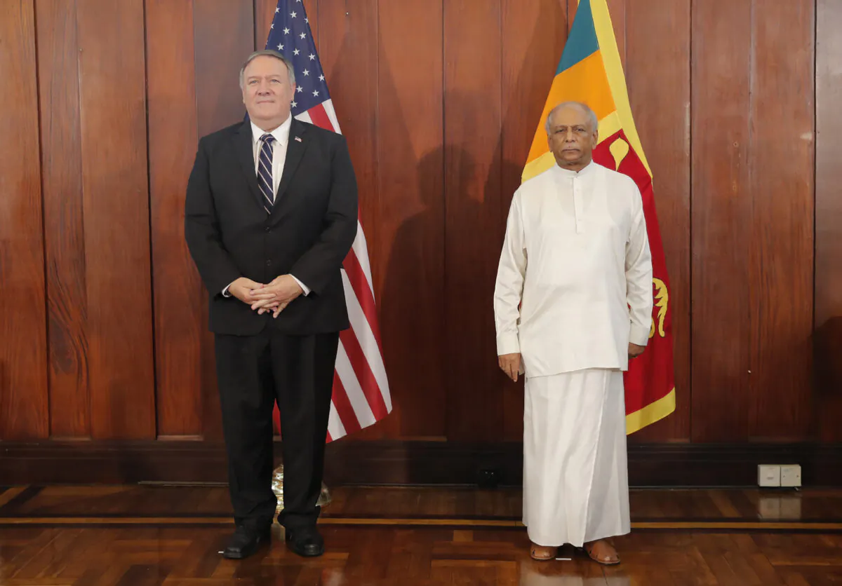 U.S. Secretary of State Mike Pompeo and Sri Lankan Foreign Minister Dinesh Gunawardena stand for photographs before their meeting in Colombo, Sri Lanka, Oct. 28, 2020. (Eranga Jayawardena,  Pool/AP Photo)
