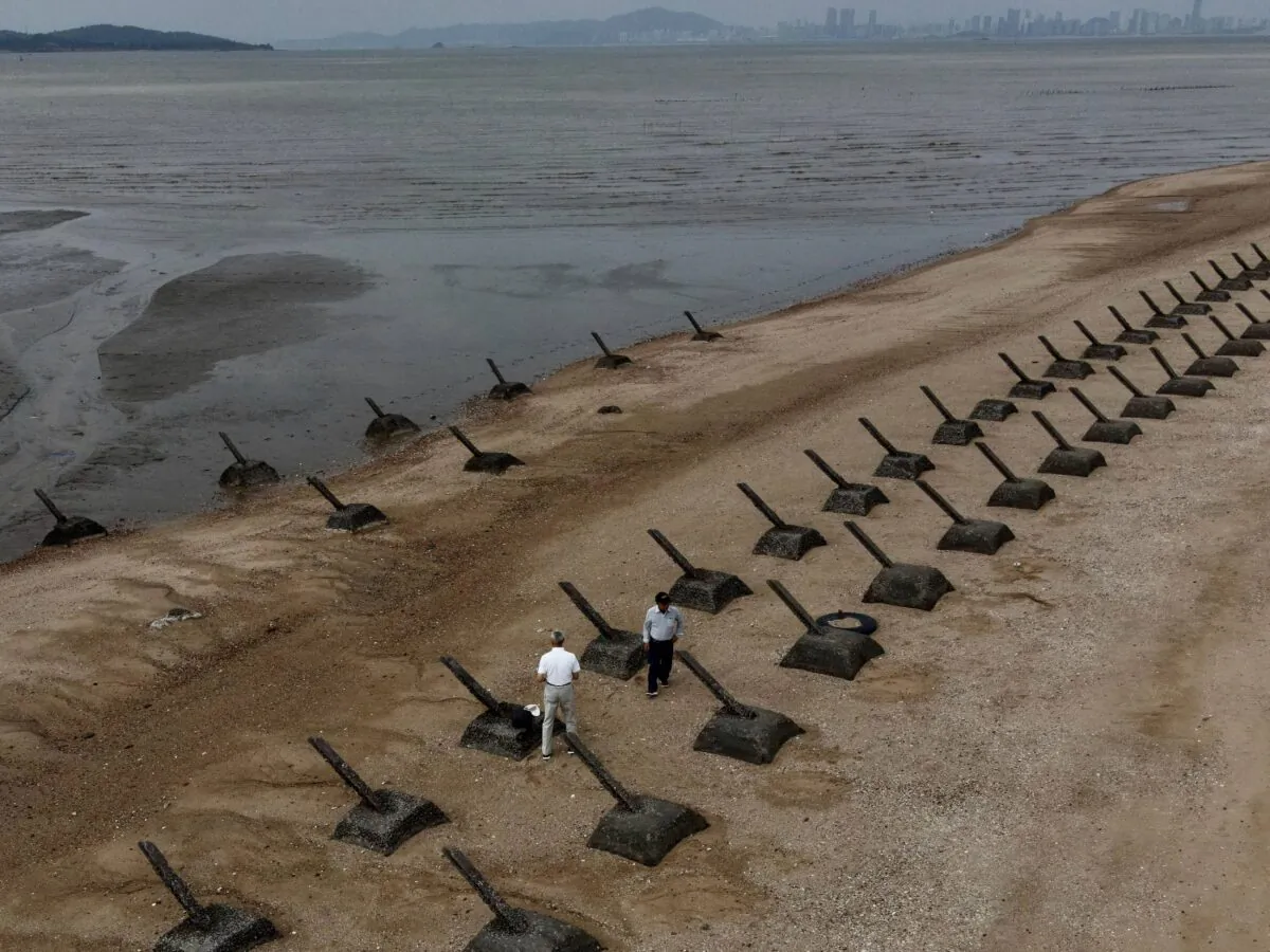 Tourists visiting the anti-landing spikes on the coast of Kinmen, the front-line islands of Taiwan, on Oct. 20, 2020. (Sam Yeh/AFP via Getty Images)