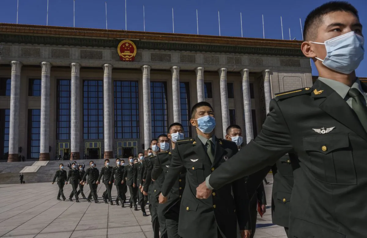 Chinese soldiers march in front of the Great Hall of the People in Beijing, China on Oct. 23, 2020. (Kevin Frayer/Getty Images)