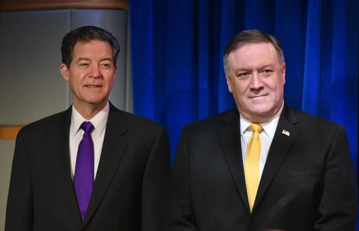 US Secretary of State Mike Pompeo (R) and Ambassador at Large for International Religious Freedom Sam Brownback are introduced during the release of the 2017 Annual Report on International Religious Freedom in Washington, on May 29, 2018. (Mandel Ngan/AFP via Getty Images)