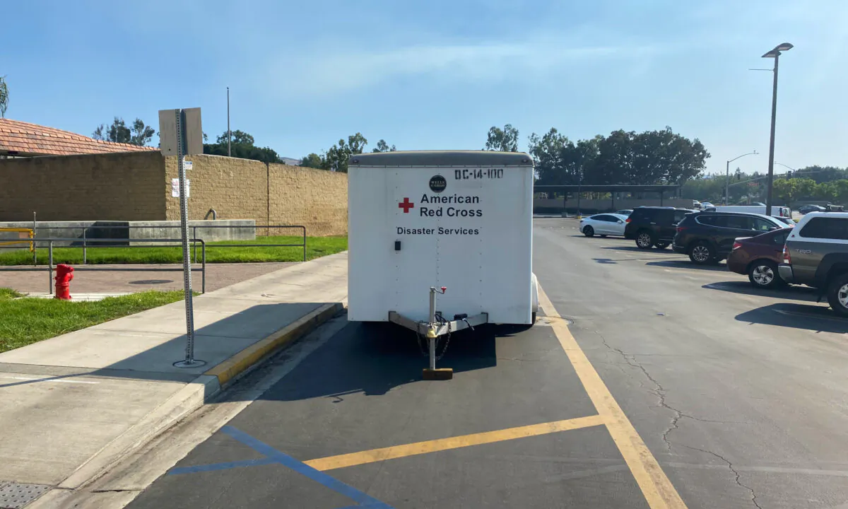 An American Red Cross trailer is parked outside an overnight evacuation center used to house people displaced by the Silverado Fire at University High School in Irvine, Calif., on Oct. 27, 2020. (Jack Bradley/The Epoch Times)