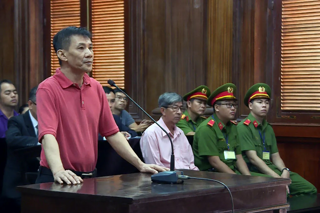 This picture from the Vietnam News Agency was taken and released on June 24, 2019, and shows U.S. citizen Michael Nguyen (L) standing on trial in Ho Chi Minh City, Vietnam. (Vietnam News Agency/AFP via Getty Images)