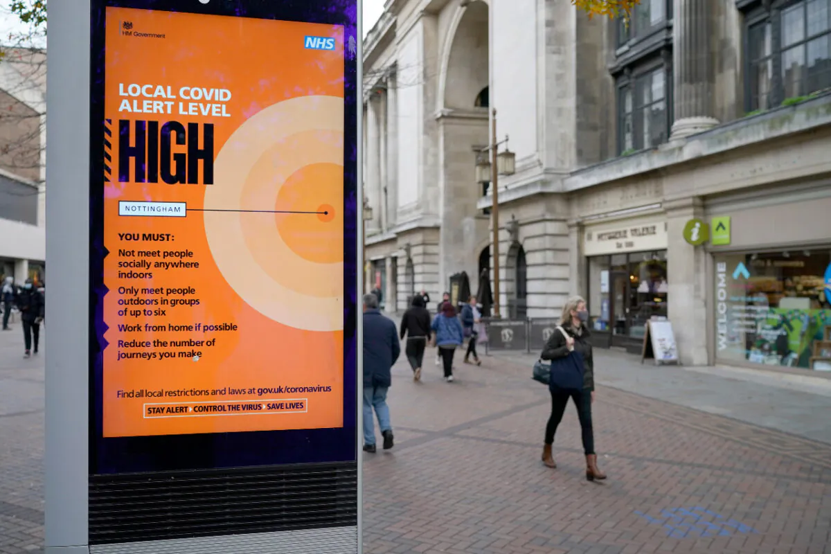 People walk through Nottingham City centre ahead of Tier Three restrictions set to take effect in Nottingham on Oct. 28, 2020. (Christopher Furlong/Getty Images)