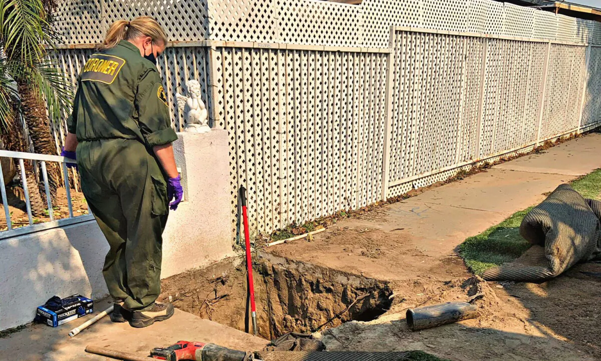 An Orange County coroner investigates the site where Native American bones were discovered in Santa Ana, Calif., on Oct. 27, 2020. (Courtesy of the Santa Ana Police Department) 