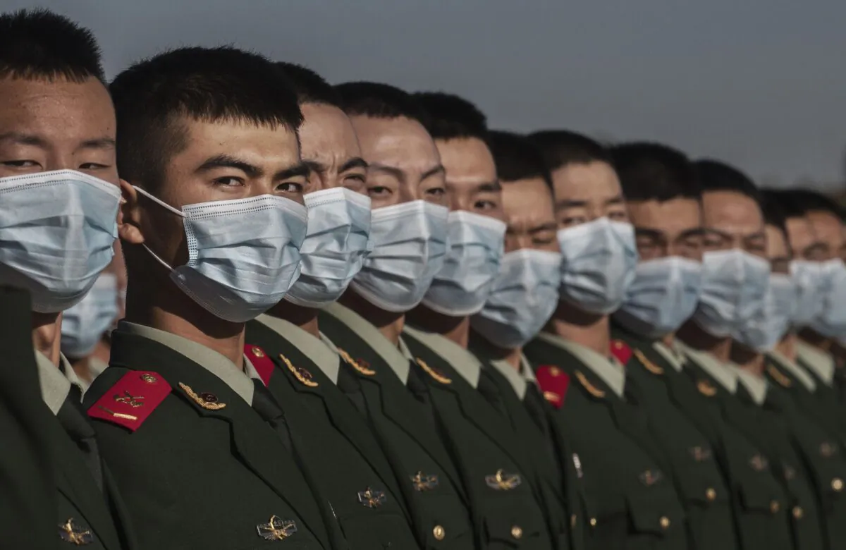 Chinese soldiers line-up after a ceremony marking the 70th anniversary of China's entry into the Korean War in Tiananmen Square in Beijing, China on October 23, 2020. (Kevin Frayer/Getty Images)