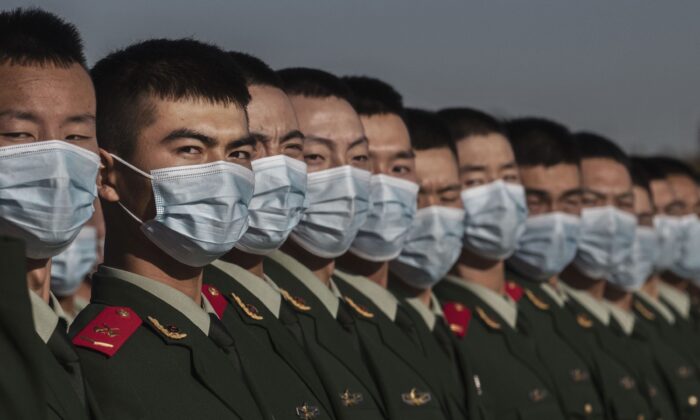 Chinese soldiers line-up after a ceremony marking the 70th anniversary of China's entry into the Korean War in Tiananmen Square in Beijing, China on October 23, 2020. (Kevin Frayer/Getty Images)
