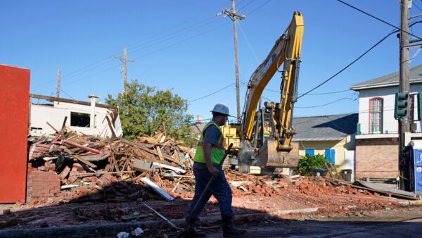 Workers remove debris