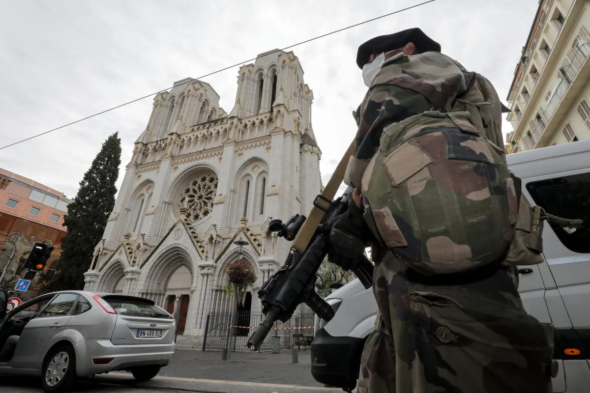 A French soldier stands in front of Notre-Dame church, where a knife attack took place, in Nice, France, on Oct. 29, 2020. (Eric Gaillard/Pool/Reuters)
