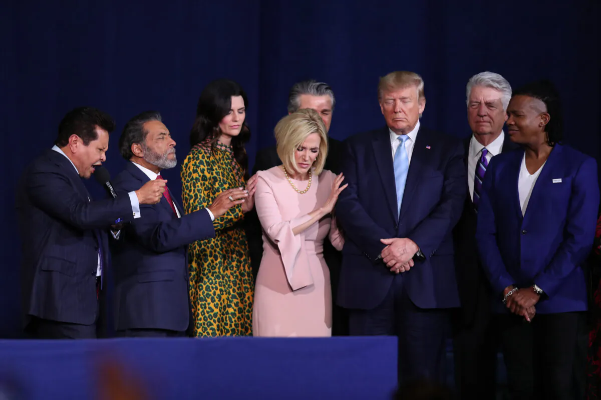 Faith leaders pray over President Donald Trump during an “Evangelicals for Trump” campaign event held at the King Jesus International Ministry in Miami on Jan. 3, 2020. (Joe Raedle/Getty Images)