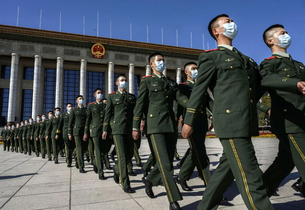 People's Liberation Army soldiers march after a ceremony at the Great Hall of the People in Beijing on Oct. 23, 2020. (Kevin Frayer/Getty Images)