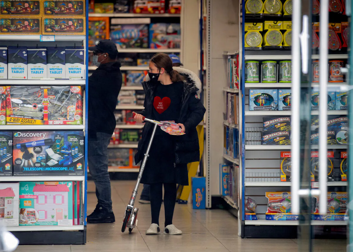 A girl shops in a toy store in Brooklyn, New York, on Oct. 13, 2020. (REUTERS/Brendan McDermid)