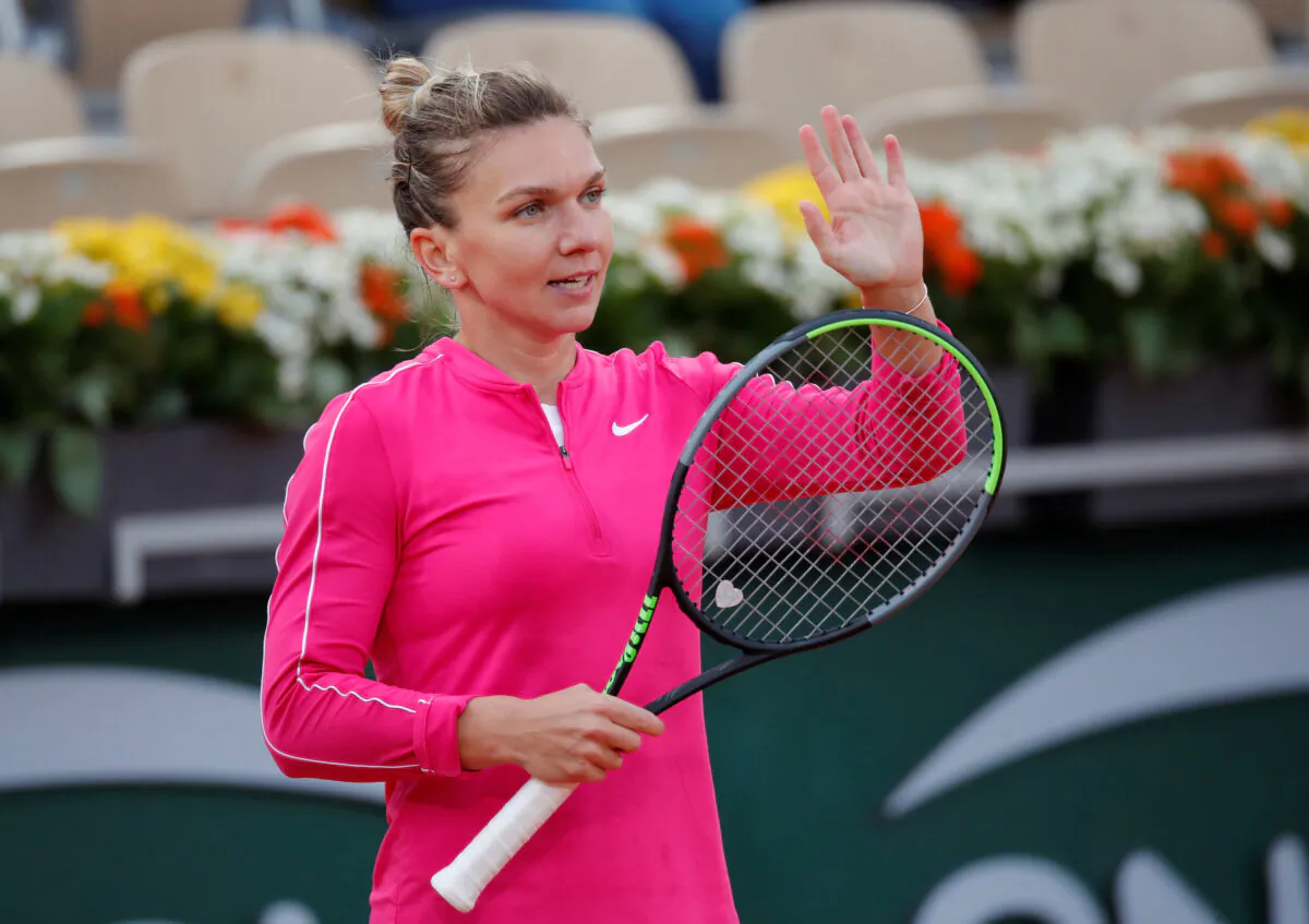 Tennis—French Open—Romania's Simona Halep celebrates winning her second round match against Romania's Irina-Camelia Begu, Roland Garros, Paris, France, Sept. 30, 2020. (Charles Platiau/Reuters)