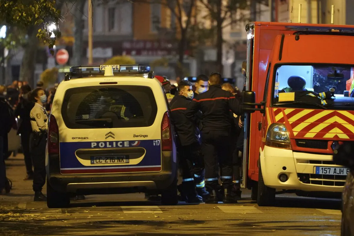 Police officers and rescue workers block the access to the scene after a Greek Orthodox priest was shot, on Oct. 31, 2020 while he was closing his church in the city of Lyon, central France. (Laurent Cipriani/AP Photo)