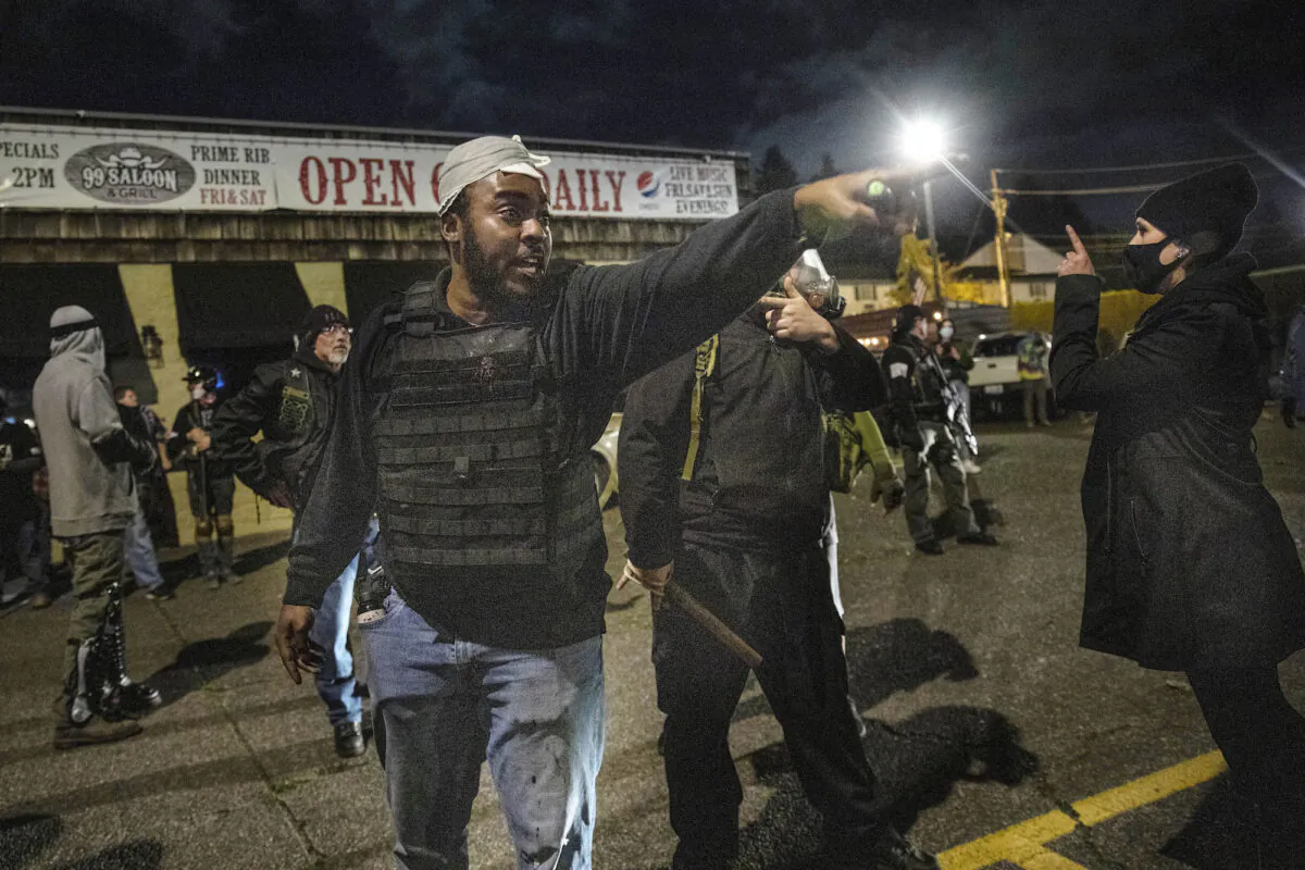 Protesters and counter-protesters confront one another in Vancouver, Wa., on Oct. 30, 2020. (Paula Bronstein/AP Photo)
